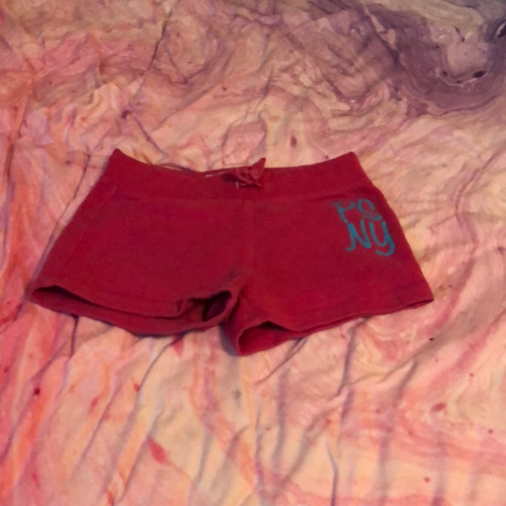 Pink shorts with blue letters